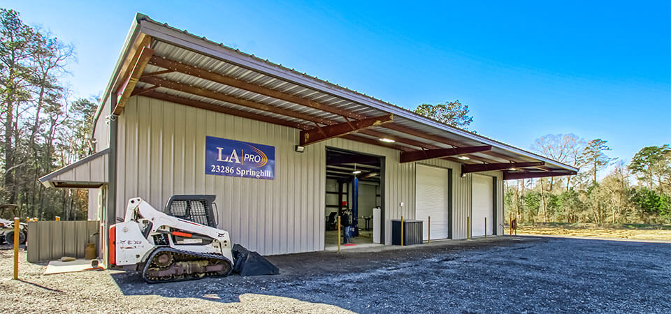 LA Pro facility with bobcat parked out front